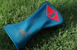 Custom fairway headcover for PGA TOUR pro John Rollins.

Turquoise Body with vibrant orange accents and mid cross stitch pattern with custom logo!