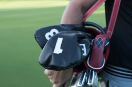 Pure Collection headcovers with pocket putter in navy/scarlet red and white accents.
